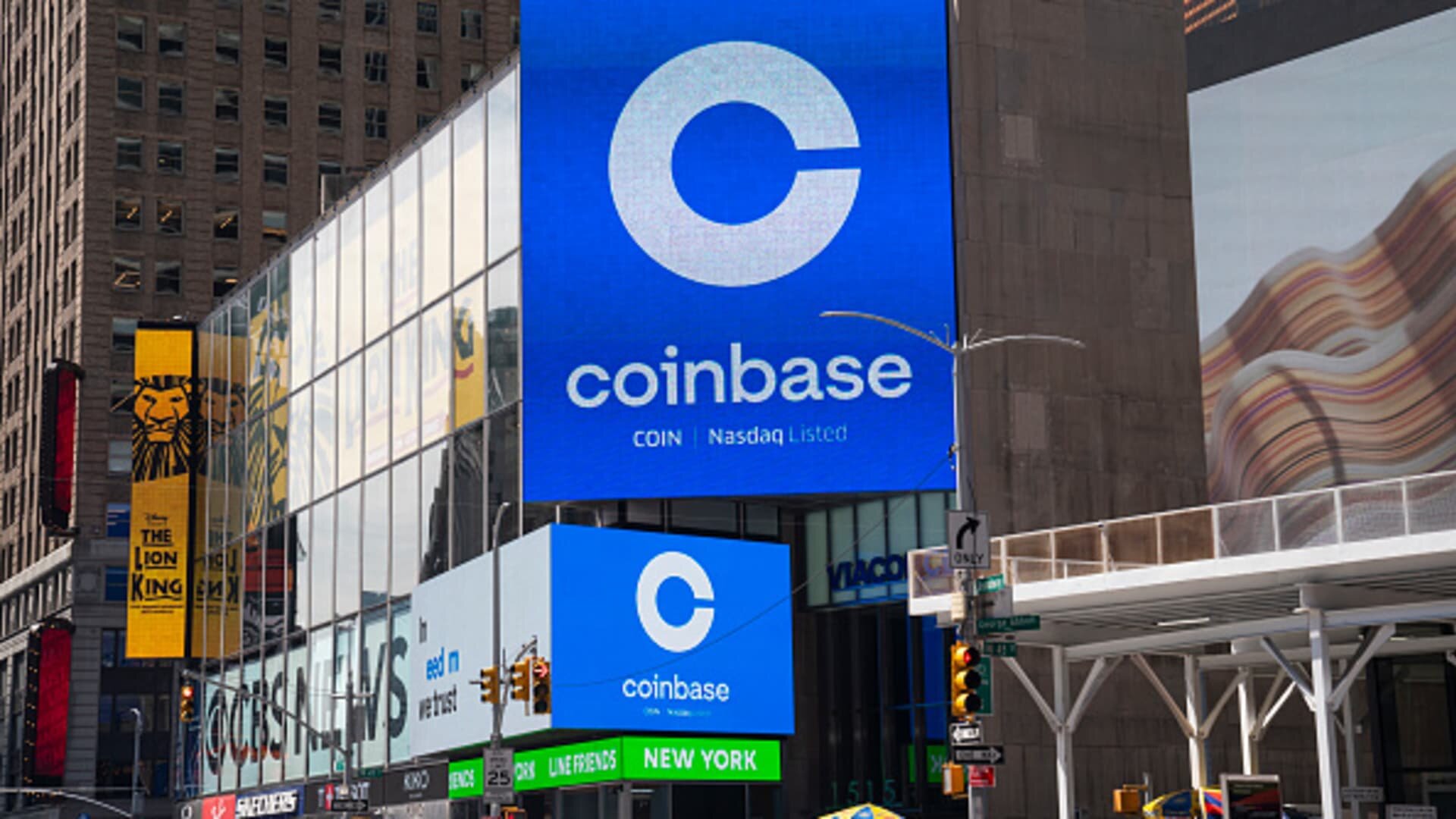 Coinbase cuts headcount by 14% citing AI acceleration. The shares are gaining - CNBC