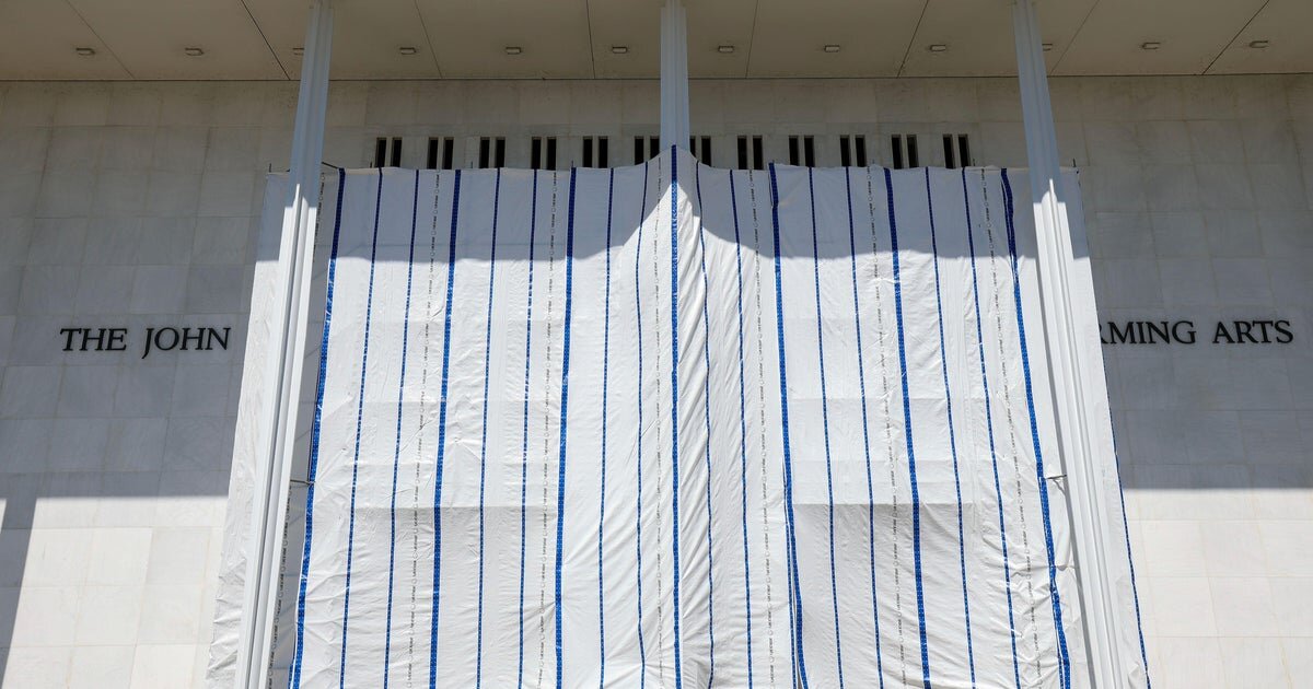 Trump's name has been removed from the Kennedy Center, a court filing says, as tarp remains up - CBS News