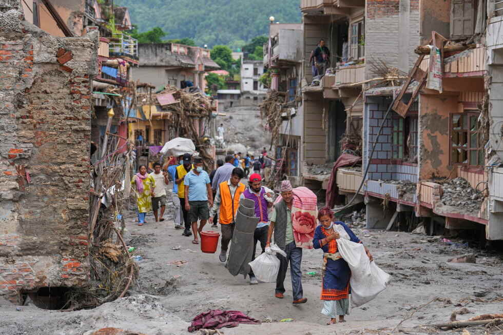 Nepal-China flood survivors reach safe areas as families await news of nearly 3,000 missing - AP News
