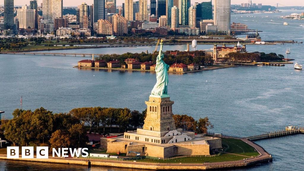 Man arrested after boat capsizes near Statue of Liberty killing woman and infant - bbc.com
