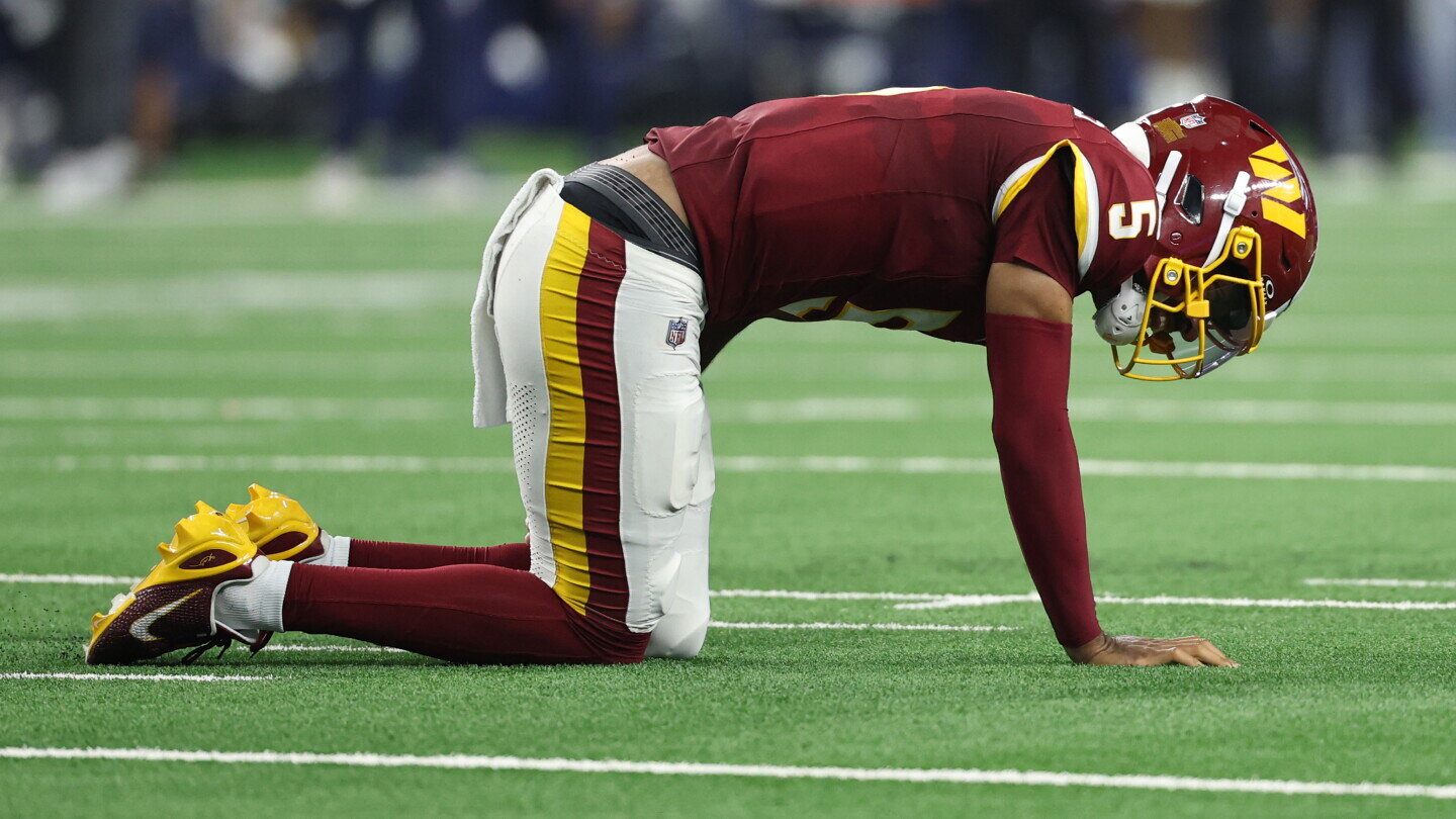 Jayden Daniels injures left arm on final play of half as Cowboys lead 17-10 - NBC Sports