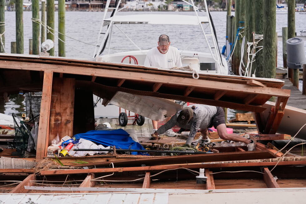 Isaias weakens but flooding threat persists as hundreds of thousands grapple with power outages - AP News