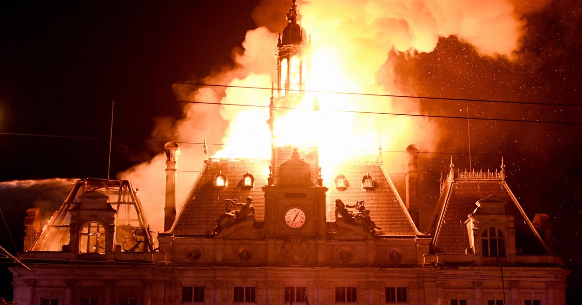 French police arrest 855 people in Paris as protests, violence erupt across country - CBS News