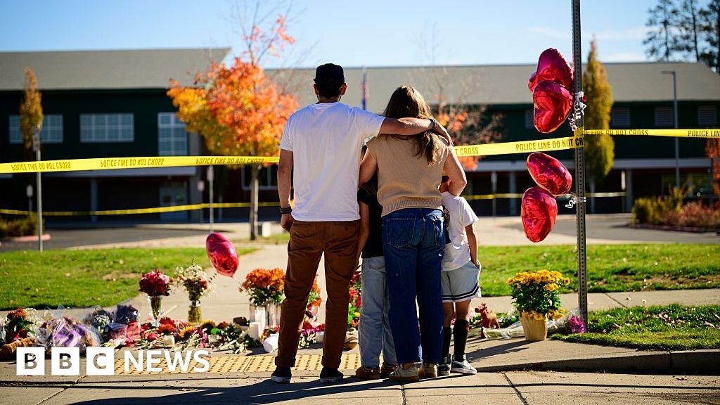 Oregon teacher fought school attacker before armed dad shot suspect 'multiple times' - BBC