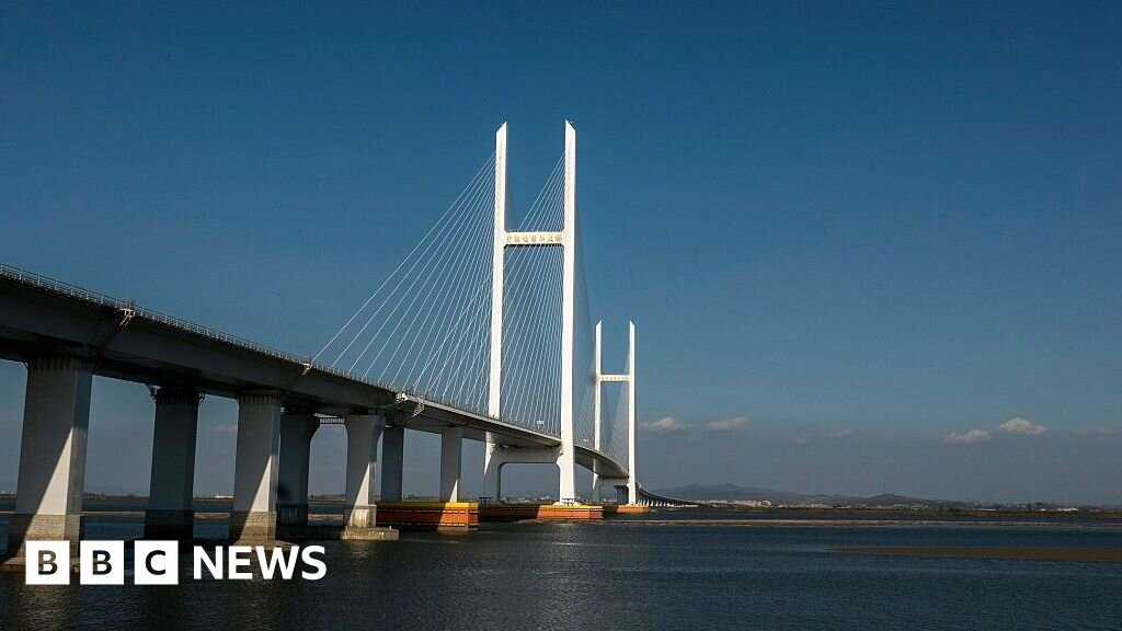 North Korea and China open new bridge after 12-year delay - BBC